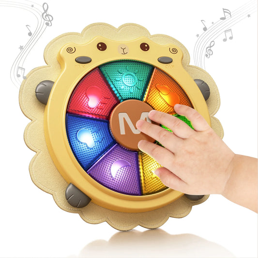 A child’s hand pressing a colorful light-up musical toy shaped like a sheep’s face. The round toy features multiple glowing sections in different colors with music note symbols, producing sounds and melodies to engage babies in sensory play and early learning.