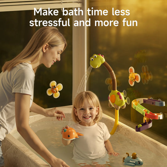 A smiling child enjoys bath time with a colorful dinosaur bath toy set, accompanied by a parent. The dinosaur toy sprays water onto a spiral track, with floating narwhal and submarine toys in the tub. Flower-shaped suction cup toys with bee and ladybug designs decorate the bath area. The text says, "Make bath time less stressful and more fun."