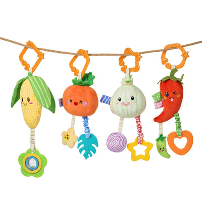 Set of four hanging plush baby rattles and teethers shaped like corn, pumpkin, onion, and chili pepper, each with colorful attachments and orange hooks for hanging.