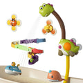 A colorful dinosaur-themed bath toy set is attached to the side of a bathtub. Water sprays from the dinosaur’s mouth, cascading down a multicolored spiral track. Suction cup flower toys with bee and ladybug designs, along with floating submarine and narwhal toys, add extra fun and sensory stimulation for children during bath time.