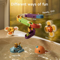 A variety of colorful bath toys are shown in action. A multicolored water slide is mounted on the tub wall, with spinning bee and ladybug toys attached nearby. Floating in the water below are a blue submarine toy and an orange whale toy. The text highlights 