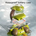 A close-up view of the dinosaur bath toy’s base reveals an exploded illustration showing its waterproof battery case, complete with a sealing gasket. Water droplets are visible on the toy, emphasizing its water-resistant design. The text reads, 