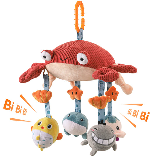 This image portrays a playful arrangement of baby plush toys thoughtfully designed for interactive play. At the center of the display is a charming crab toy featuring a distinct blue hanging element, which serves as a focal point. The plush toys are soft and textured, creating an inviting sensory experience suited for infants.