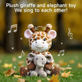 Interactive Giraffe and Elephant Stuffed Animals sitting on green grass with autumn leaves, featuring animated arrows and musical notes to emphasize their 'We sing to each other' feature and voice recording function.