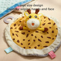 Round giraffe-themed security blanket lovey with a plush giraffe head in the center and a yellow spotted fabric body with brown accents. The blanket has a white fluffy edge, colorful fabric tags, and an attached teether. Text overlay reads “Large size design, Good for wiping hands and face.”