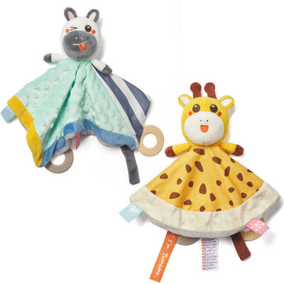 Two baby security blankets, one with a plush zebra head and blue-green fabric with stripes and textured dots, and the other with a plush giraffe head and yellow spotted fabric. Both blankets have colorful tags and rubber teething rings attached at the edges.
